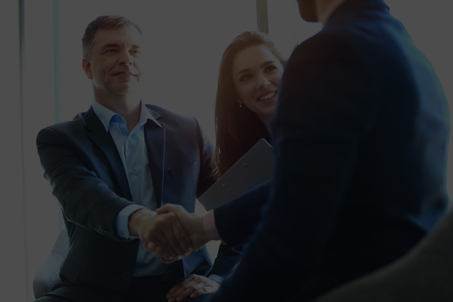 Business people shaking hands, finishing up a meeting